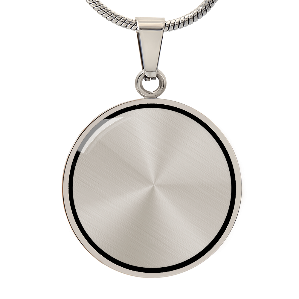 Circular silver pendant with a brushed finish and no engraving, photographed on a white background.