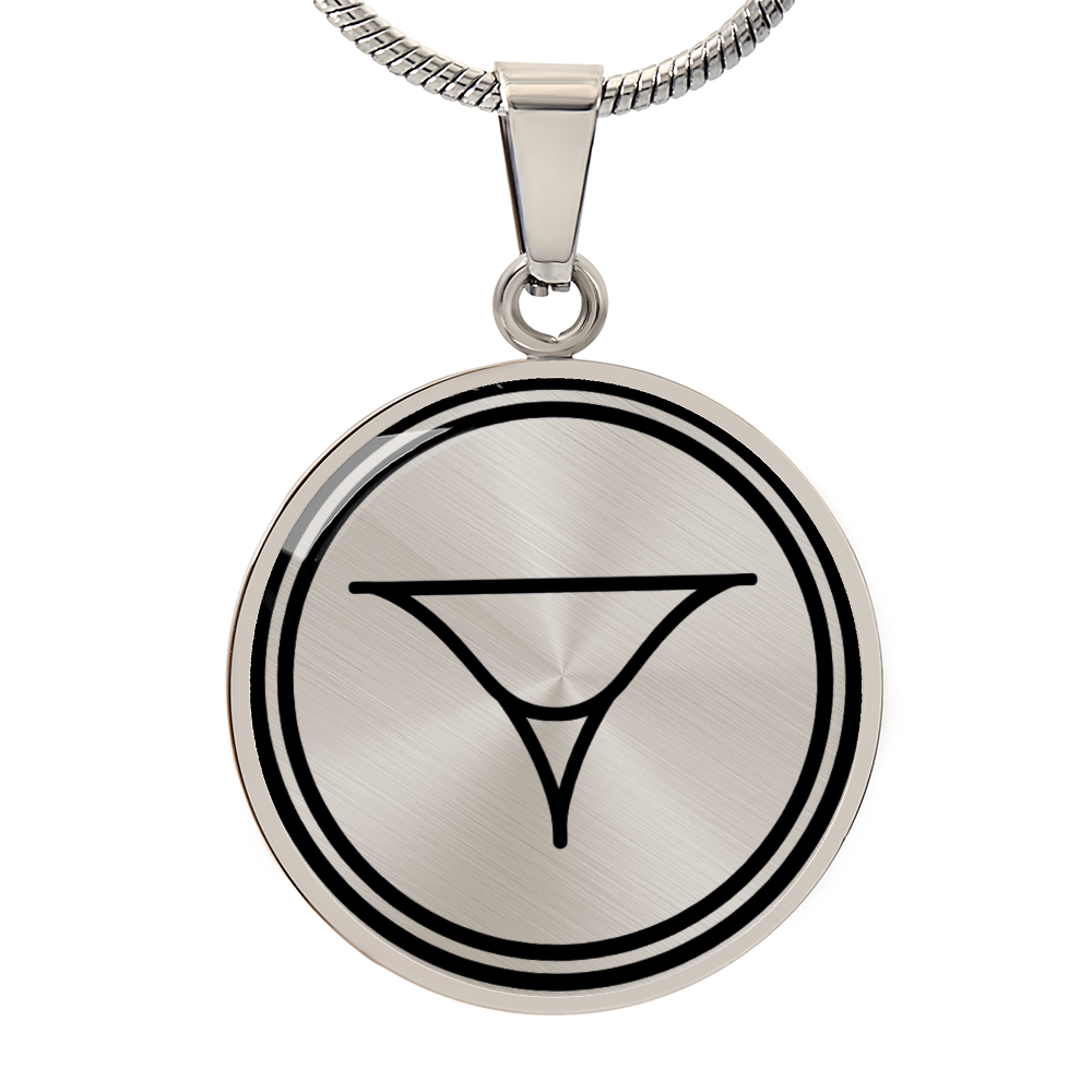 Circular silver pendant engraved with a minimalist geometric symbol, photographed on a white background.