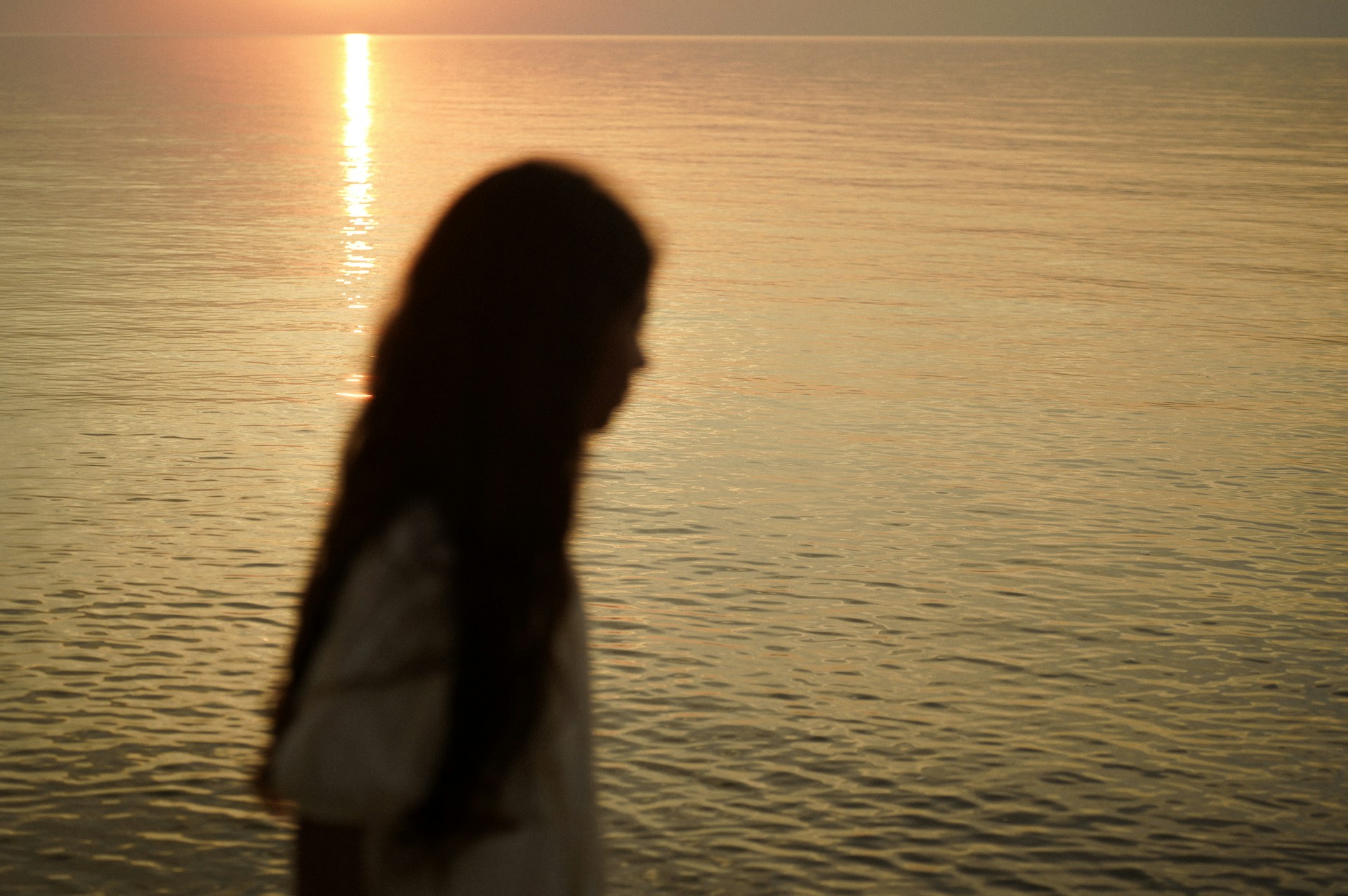 woman alone at beach missing an ex