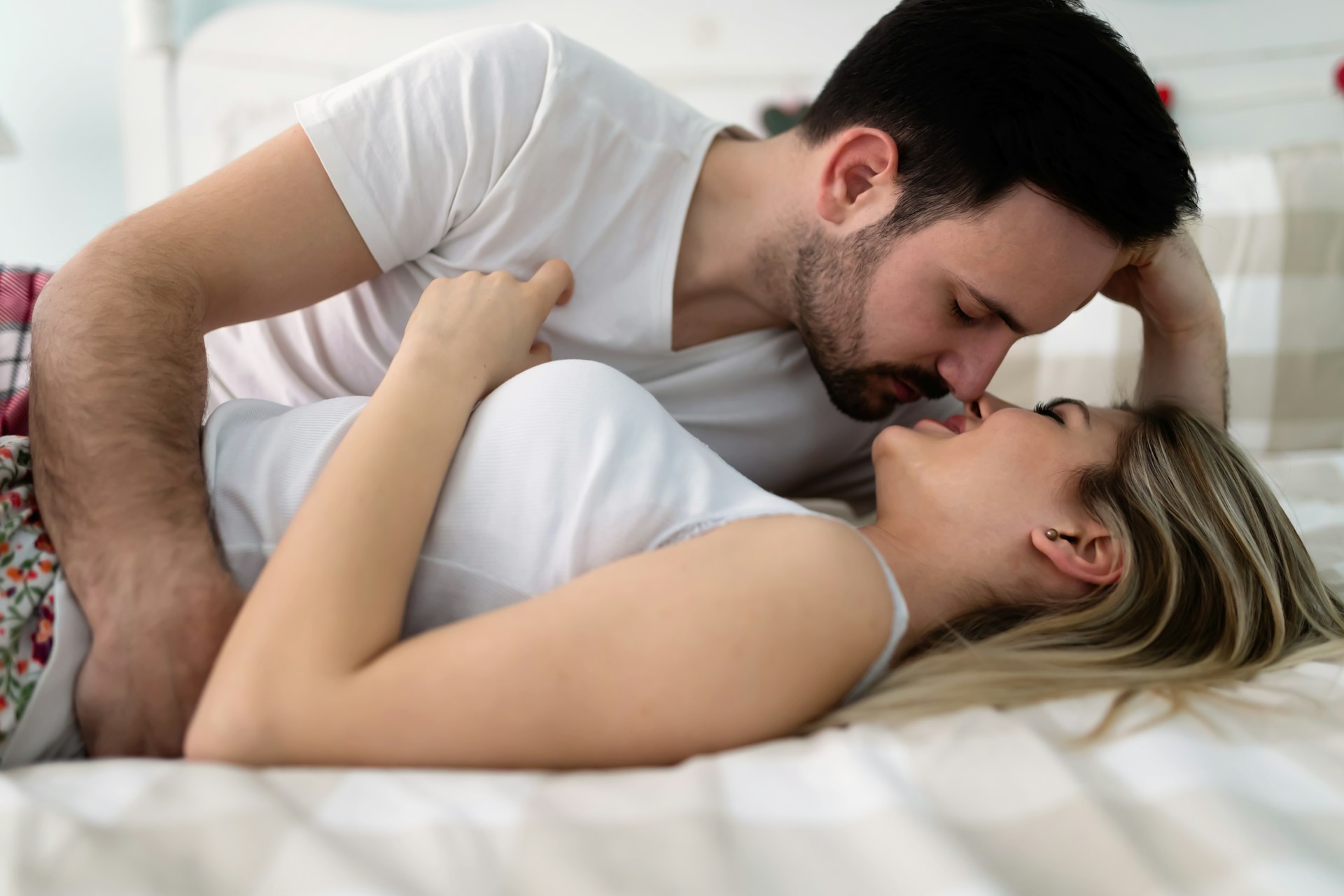 couple laying in bed symbolizing fwb after breakup.